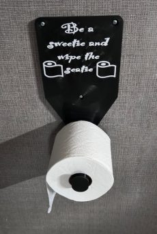 bathroom novelty gift - toilet paper roll holder with "Be a Sweetie and wipe the seatie". AirBnB Cleanliness - Closeup