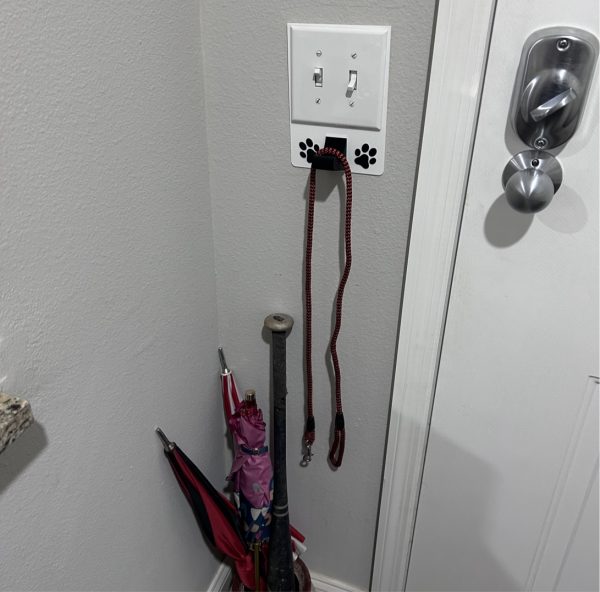 2 gang universal fit dog leash holder for wall mount for underneath outlet wall plate with paw prints - showing use