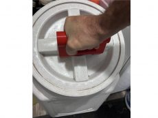 ‎red gamma seal lid tool handle used on 50lb vittles pet food container